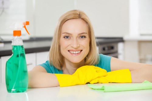 Carpet cleaning technician preparing equipment for a residential service